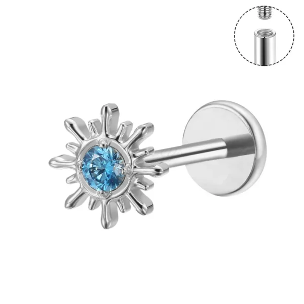 ASTM F136 titanium labret stud with sunburst design and blue crystal